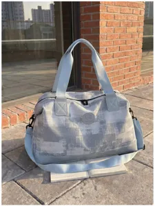 Large capacity travel duffel bag for women, portable lightweight luggage bag for short trips.