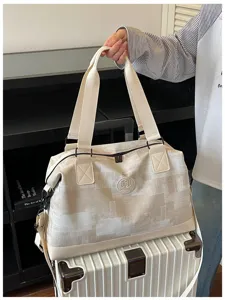 Large capacity travel duffel bag for women, portable lightweight luggage bag for short trips.