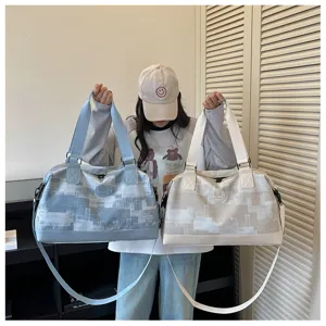 Large capacity travel duffel bag for women, lightweight portable luggage bag for short trips.