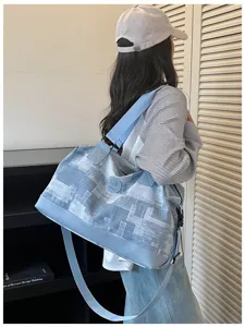Large capacity travel duffel bag for women, lightweight overnight carry-on luggage bag.