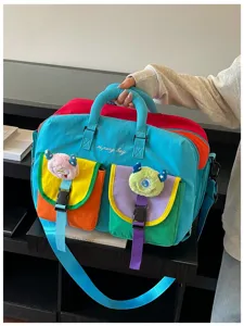 Color-blocking travel yoga bag large capacity fitness duffel bag with cute plush charms.