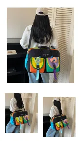 Color-blocking travel bag with cute plush charms, multi-pocket casual gym bag for daily use.