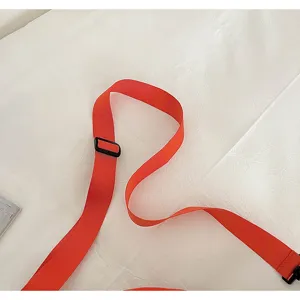 Dopamine bright orange adjustable bag strap detail, durable webbing for travel cross body bags.