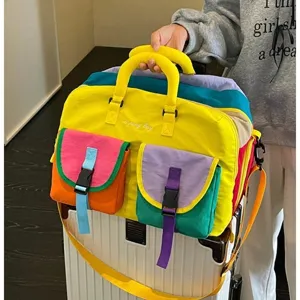 Colorful multi-pocket travel duffel bag with practical front buckles for outdoor and gym use.