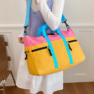 Large capacity color-block travel duffel bag with shoulder strap for women sports fitness