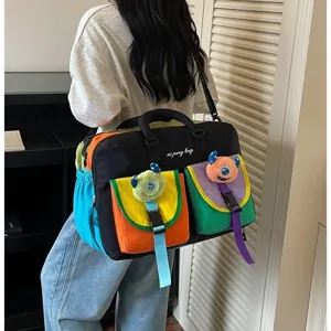 Korean color block travel fitness bag with cute plush monster pendants for casual outdoor sports