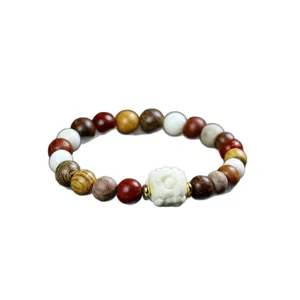 Multi-material wooden beaded bracelet with carved charm, unique ethnic jewelry accessory.