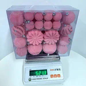 Pink flocked Christmas baubles set in a clear gift box, perfect for tree decoration.