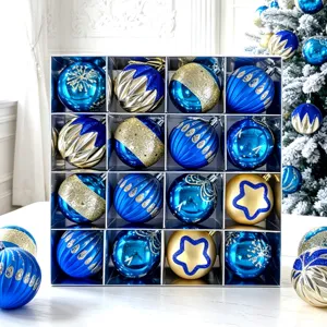 Close-up view of blue and gold Christmas tree baubles in a neat gift box display detail.