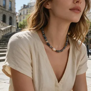Closeup shot of vintage irregular chip stone necklace with pearl and gold accents for women