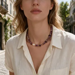 Exquisite gemstone chip necklace featuring a central pearl and delicate gold spacer beads.