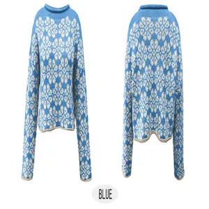 Detail view of blue knit sweater featuring classic snowflake jacquard pattern and long sleeves.