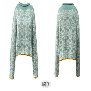 Green loose knit sweater detail, long sleeves, crewneck, and cozy snowflake jacquard design.