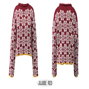 Detailed view of red winter knitted sweater featuring white snowflake pattern and long sleeves.