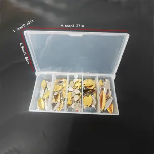 Close-up detail of metal fishing lure spinner blades organized in a clear storage box.
