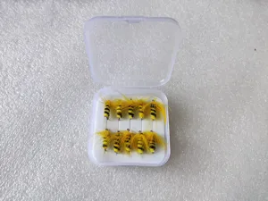 Detailed close-up of boxed fly fishing bee lures in a clear plastic case with foam.