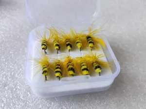 Detailed view of yellow and black bee-shaped fly fishing hooks set in a clear plastic box.