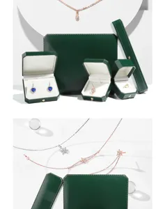 Dark green octagonal jewelry boxes with gold trim, elegant gift box for rings and necklaces.