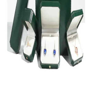 Dark green octagonal gold-rimmed jewelry box set for rings, necklaces, earrings and bracelets.