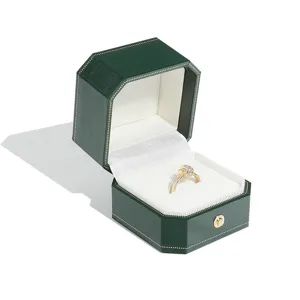 Elegant dark green octagonal jewelry box with gold trim, vintage ring storage gift case.