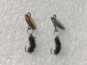 Micro fishing lure spinner set with fly hook, metal blade and bead for trout fishing.