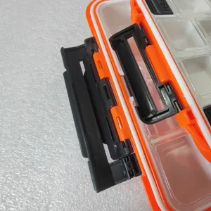 Portable double-sided plastic fishing lure storage box with secure latch and compartments.
