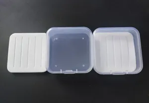 Transparent plastic fly fishing lure box with white foam insert for micro lures and hooks.