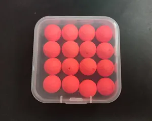 Detail view of 12mm foam fishing floating balls neatly packed in a clear storage box.