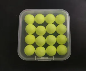 Close-up view of 16pcs fluorescent yellow fishing foam floating beads in a clear box