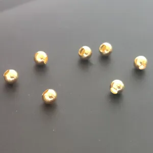 Gold metal beads spacer stoppers for jewelry making or fishing line accessories, shiny finish.