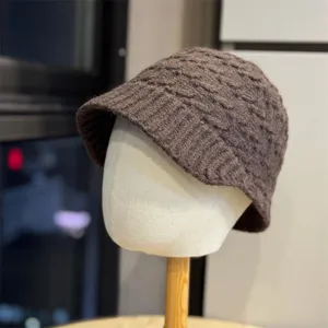 Dark brown knit woolen hat close up view, autumn winter warm ear protection beanie
