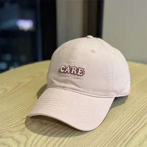 Pink cotton baseball cap with stylish CARE embroidery front design for women daily wear.