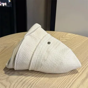 Detailed close-up view of a folded off-white textured bucket hat for women casual wear