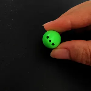 Green mini fishing casting bubble bead lure accessory with three holes for micro fishing gear setup.