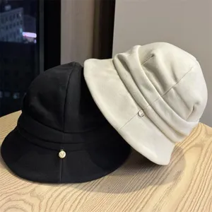 Minimalist autumn solid color bucket hat with stylish pleated design and short brim.