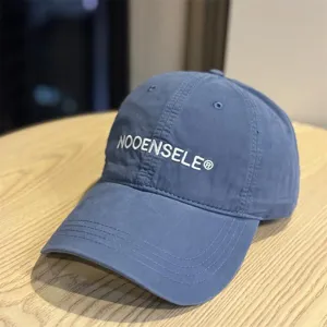 Classic washed baseball hat in stylish blue, featuring a curved brim and casual streetwear appeal.