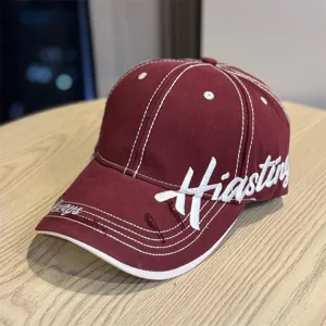Retro embroidered baseball cap with contrast stitching and curved brim for sun protection.