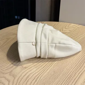 Off-white solid color short brim pleated bucket hat, minimalist niche design for autumn outdoor.