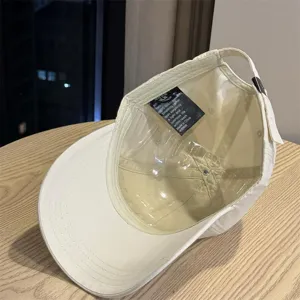Washed cotton baseball cap interior detail view, casual curved brim design for daily wear.