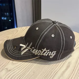 Retro embroidered baseball cap for women, hard top large brim sun hat with contrast stitching.