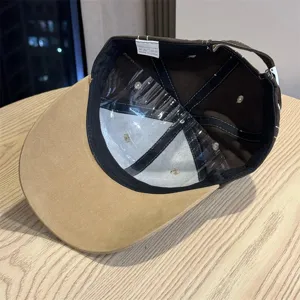 Retro brown baseball cap interior detail view showing cotton fabric and structured brim.