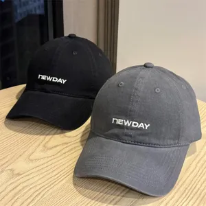 Close-up of the washed cotton baseball cap showing front embroidery detail and soft top design.