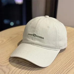 Casual distressed baseball cap detail view, vintage embroidered style for outdoor wear.