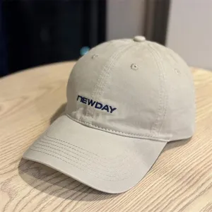 Beige washed cotton baseball cap detail, soft top casual duck tongue hat with embroidery.