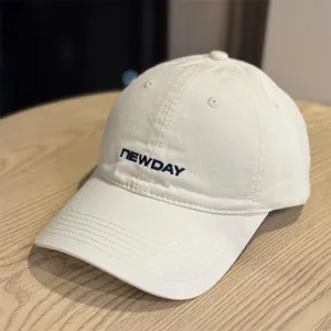 Detailed view of the washed cotton baseball cap with curved brim and front embroidery.