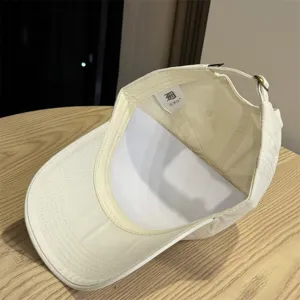 Detailed view of the washed cotton baseball cap interior showing the inner brand label.