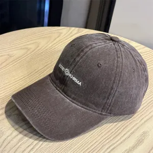 Detailed view of the vintage washed baseball cap with white embroidered text design.