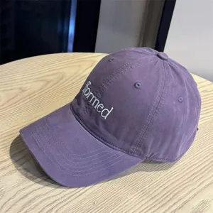 Purple embroidered baseball cap with formed letter design, casual street style hat for daily wear.