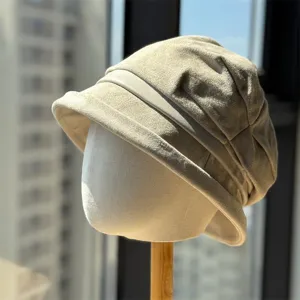 Close-up detail of the vintage pleated suede bucket hat showing texture and fine brim craftsmanship.