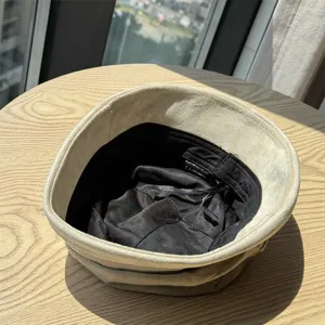 Detailed view of the vintage suede bucket hat interior lining and soft fabric texture.